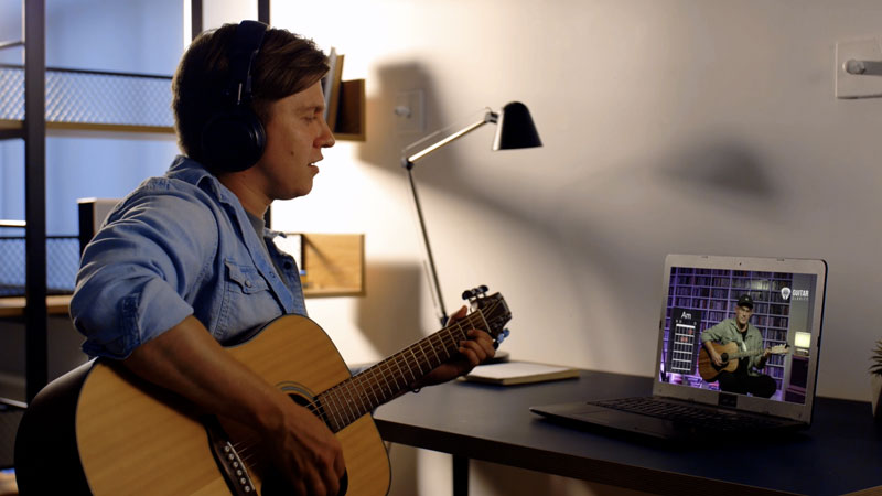 Guitar student chatting with AI assistant